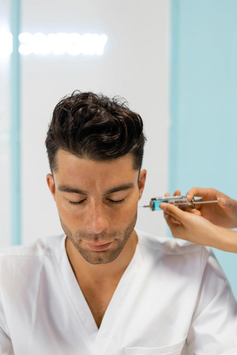 A man receiving a beauty injection in a modern clinic setting, focusing on aesthetic enhancement.